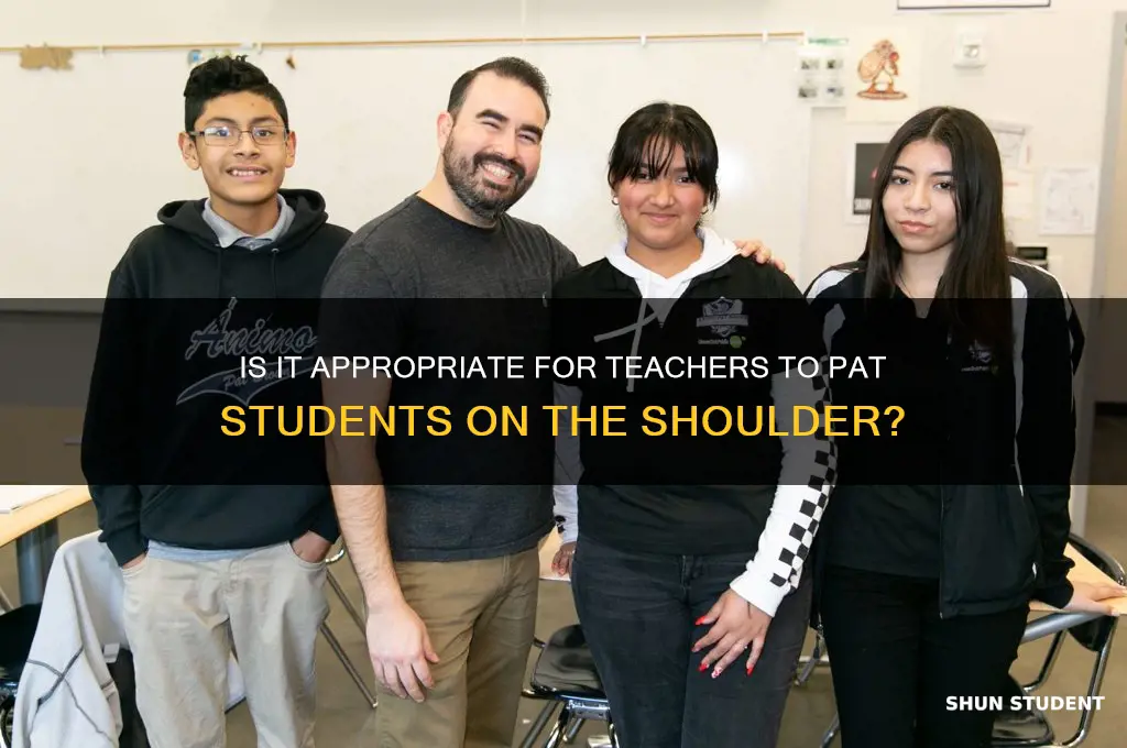 may a teacher pat a student on the shoulder